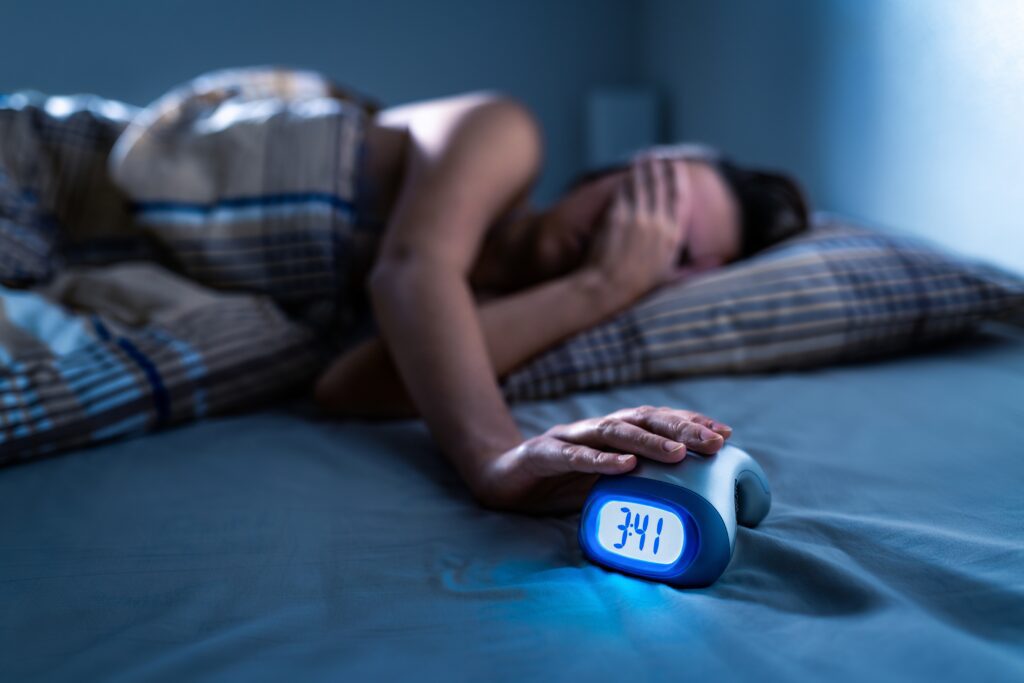 woman struggling to sleep through the night