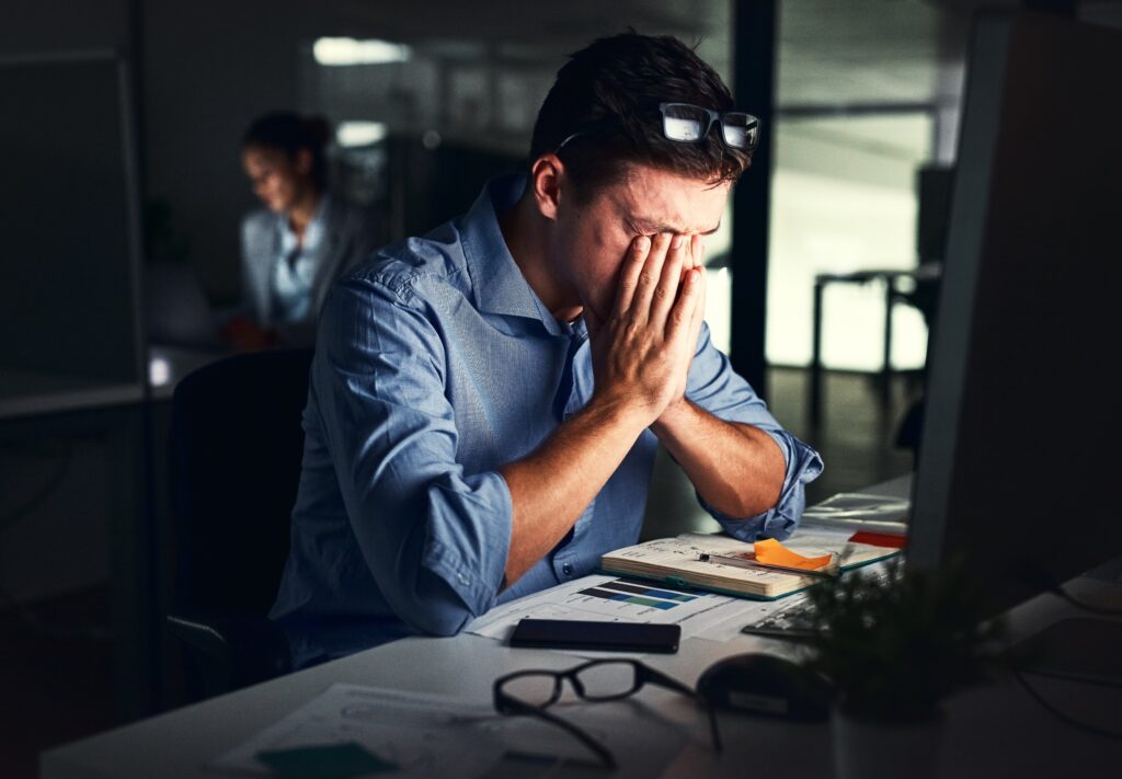 stressed out man suffering from sleep apnea related mental health issues